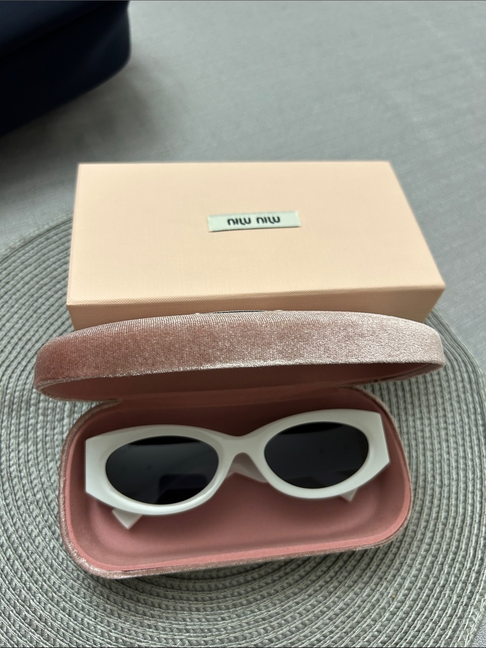 Miu Miu White Oval Sunglasses with Dark Lenses